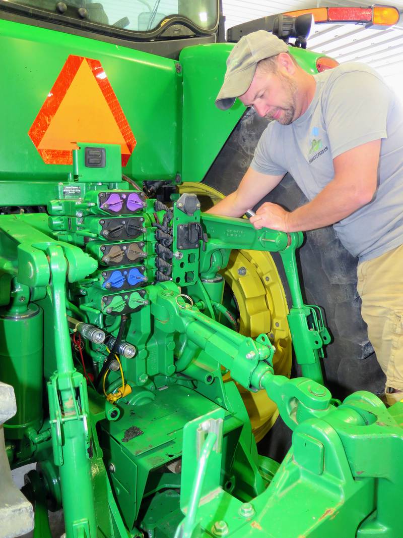 Craig Swartz is replacing a height sensor on the three-point of his tractor. The fifth-generation farmer wrapped up planting April 29 and is transitioning to summer duties of cleaning out bins, trucking, reshaping waterways and other responsibilities.