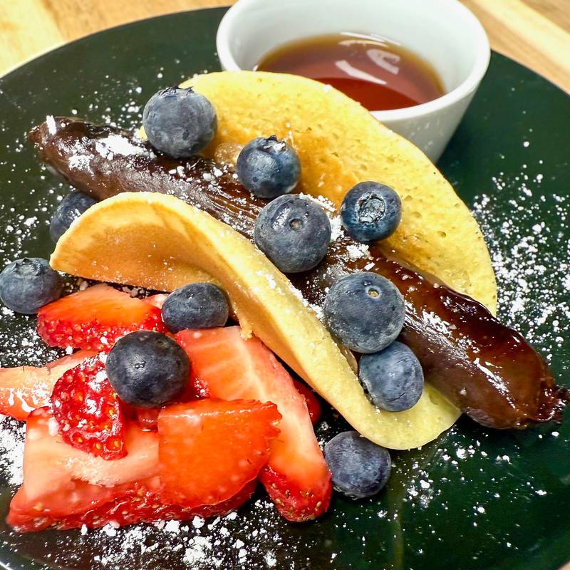 Blueberry Breakfast Sausage Flapjack by Smokehouse Saloon (Red Frazier). House made blueberry breakfast sausage wrapped in a flapjack. Served with fresh fruit, powdered sugar and syrup.
