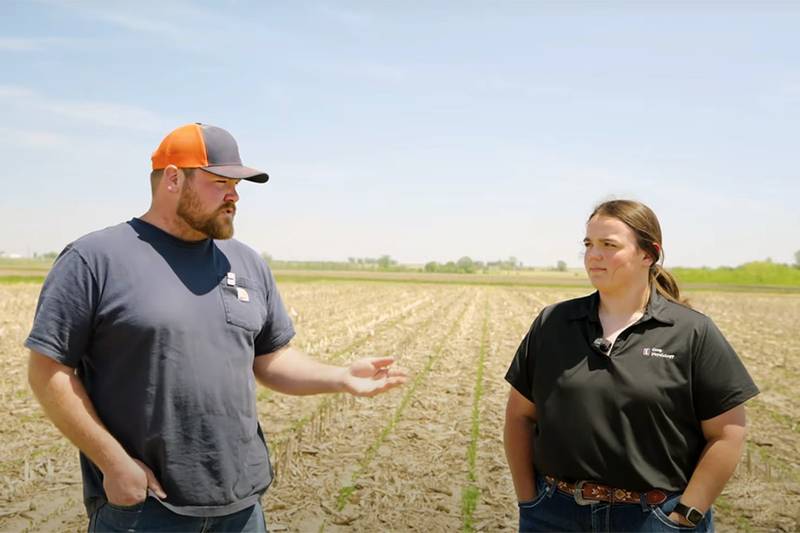 Connor Sible (left) and Ava Isaacs were part of the team of researchers at the University of Illinois working on the 2025 Soybean Systems Management Trial. Averaged across foliar treatments in the trial, Hopper Throttle MaxStax Soybean on naked soybeans had an advantage over commercial seed treatment by 2.3 bushels per acre.