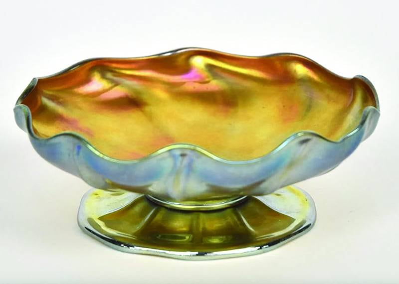 To a bottle collector, iridescence is a kind of damage. In the world of art glass, especially Tiffany’s, it’s an extremely desirable decoration.