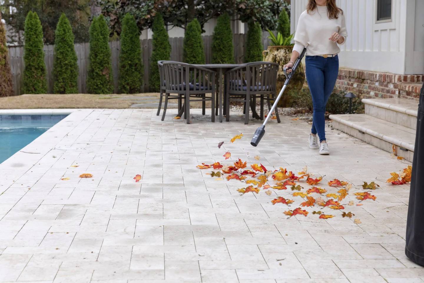 This image provided by ZoomBroom shows a lightweight, cordless ZoomBroom stick blower in use.