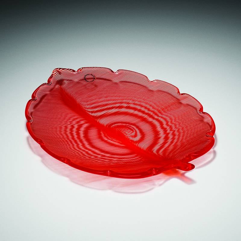 Venetian glass factories brought modern style and international influence to their products. This leaf-shaped bowl made by Venini was the work of Swedish designer Tyra Lungren.