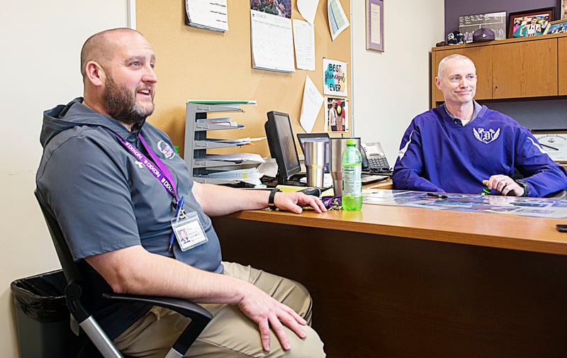 Current and past principals Jared Shaner (left) and Mike Grady have worked with the team led by Lee County farmer Aaron Book to restore agriculture education at Dixon High School.