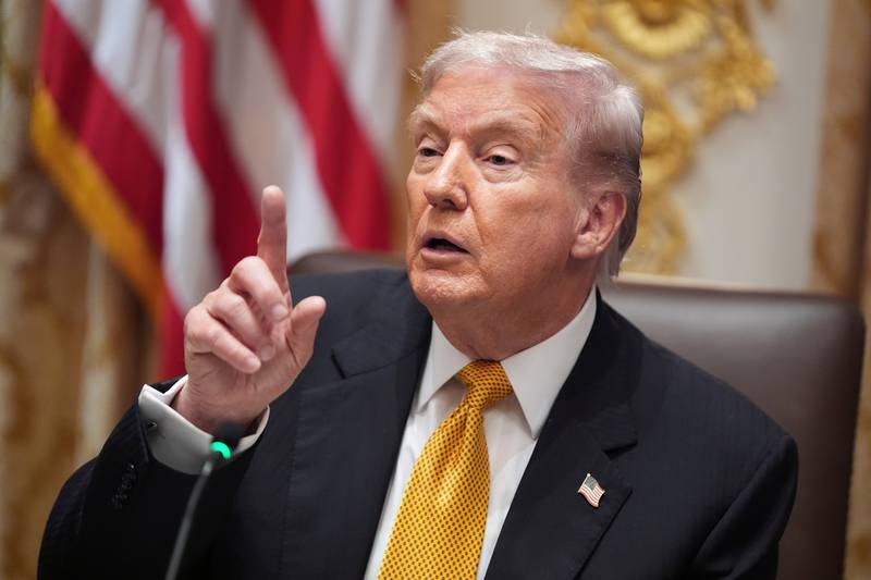 President Donald Trump speaks with reporters during a meeting with Hungary's Prime Minister Viktor Orban in the Cabinet Room of the White House.