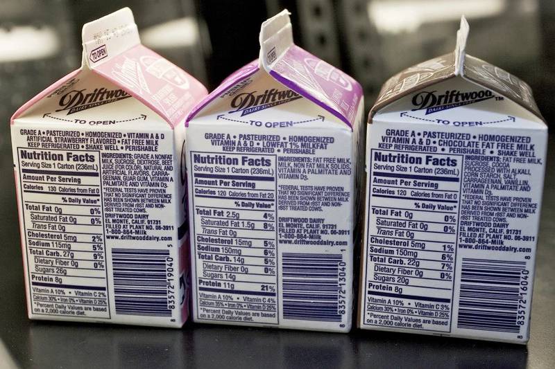 Milk cartons are displayed at a high school cafeteria in Los Angeles. A shortage of half-pint milk cartons is affecting school meals in cafeterias across the United States in 2023. School officials from New York to California are scrambling for backup options after a main supplier of cartons said demand has outstripped supply.