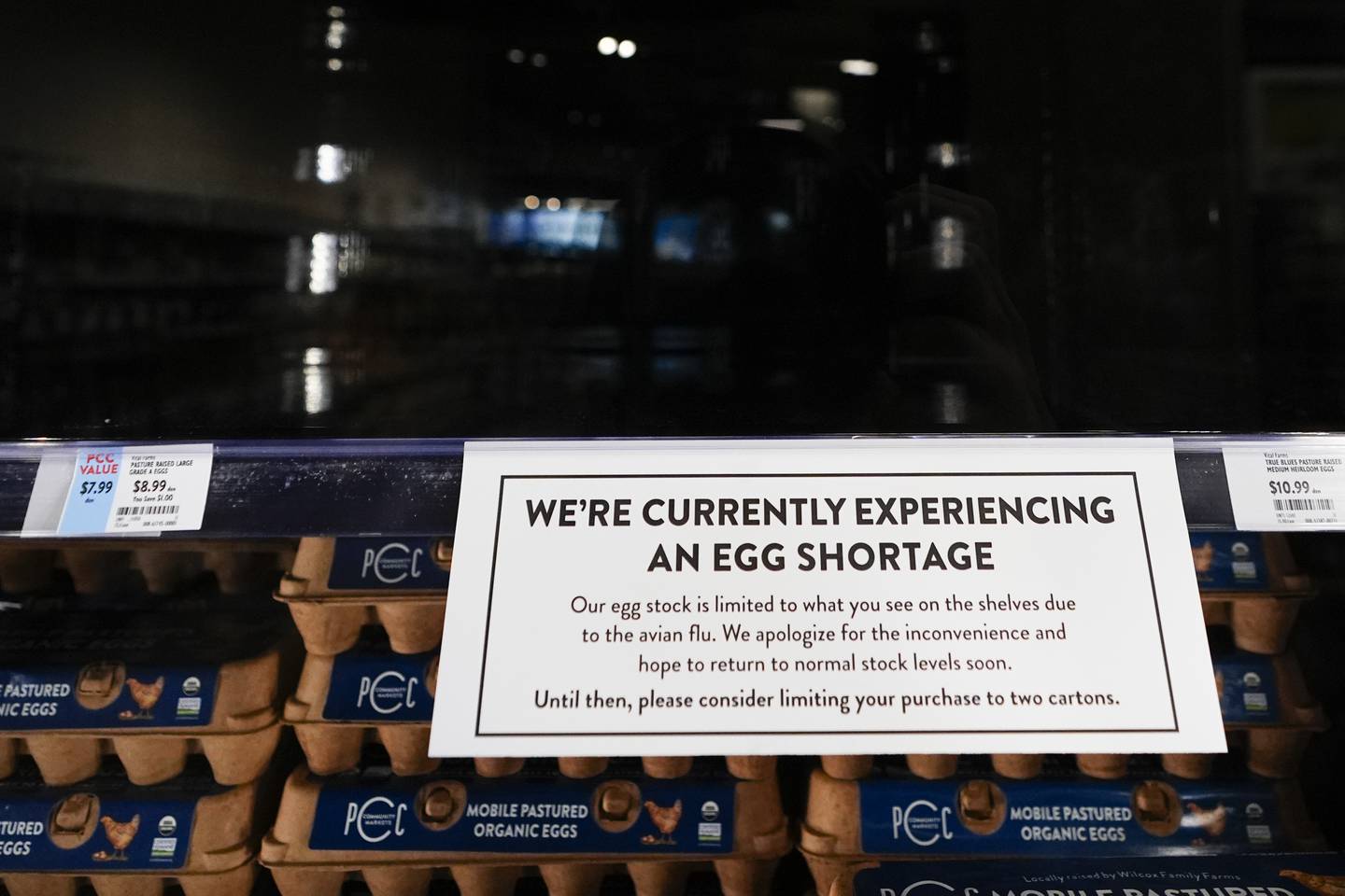 A sign asks customers to consider limiting their purchases of eggs at a PCC Community Markets grocery store due to shortages caused by avian flu in Seattle.