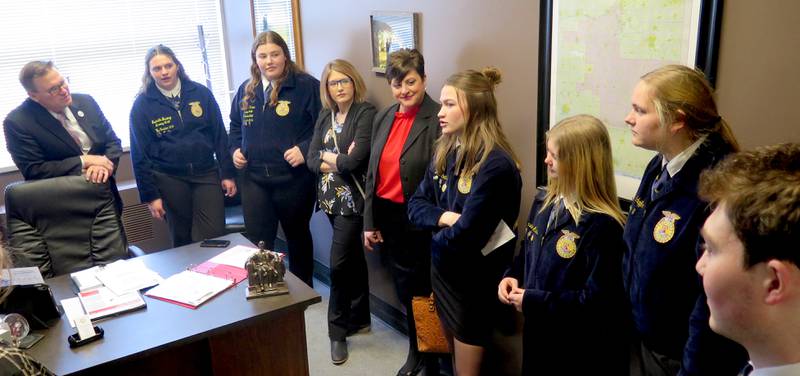 State Rep. Jason Bunting (left) meets with FFA members of the Dwight Township High School and Prairie Central High School, Fairbury, during Illinois Agriculture Legislative Day on March 13. His daughter, Isabella, is next to him.